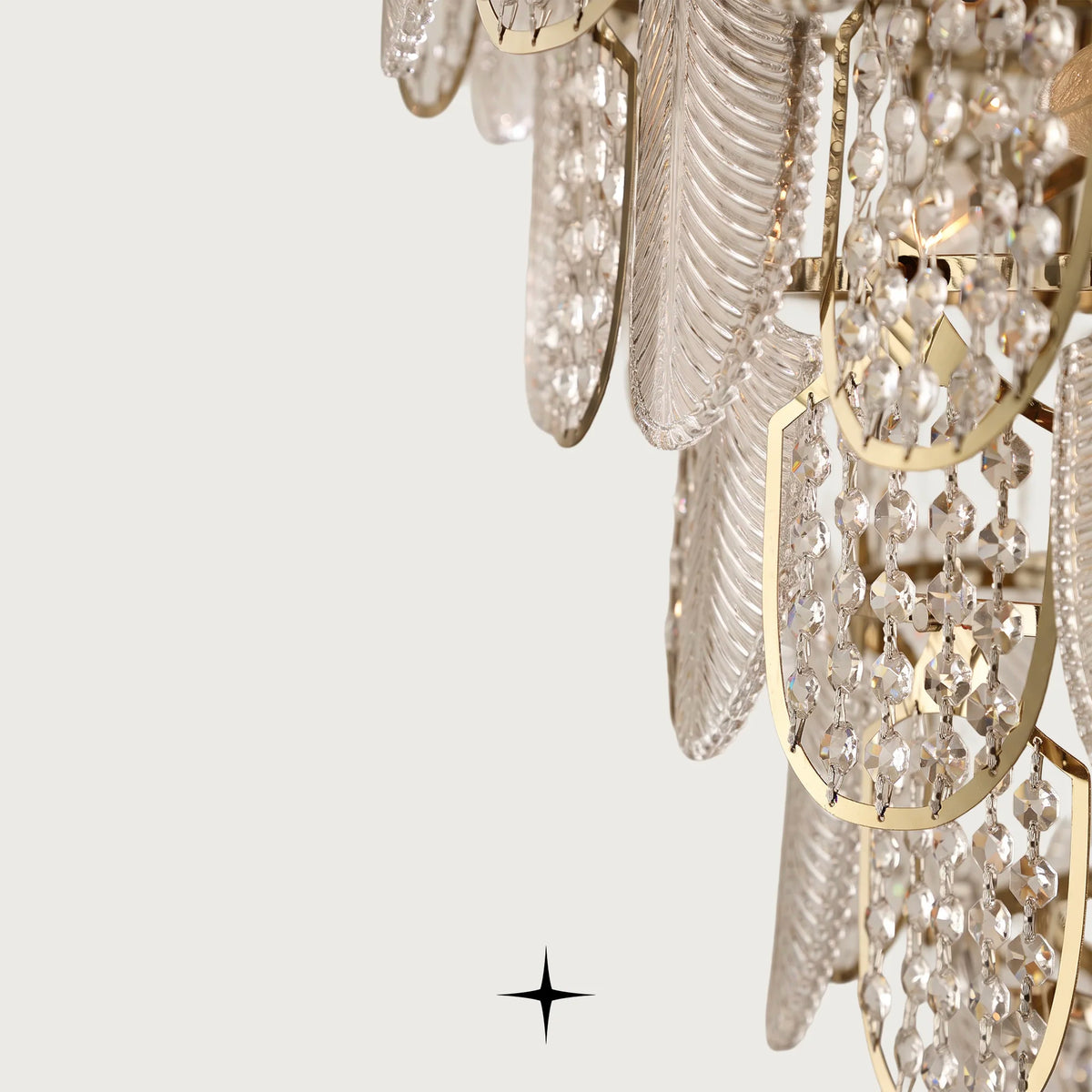 Close-up detail of golden metal rings and textured Murano glass leaves on Grand Orlando fixture