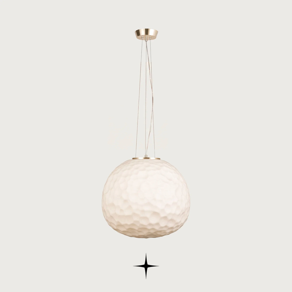 Lavish Zara large glass sphere pendant light suspended over a formal dark dining table with ocean view window