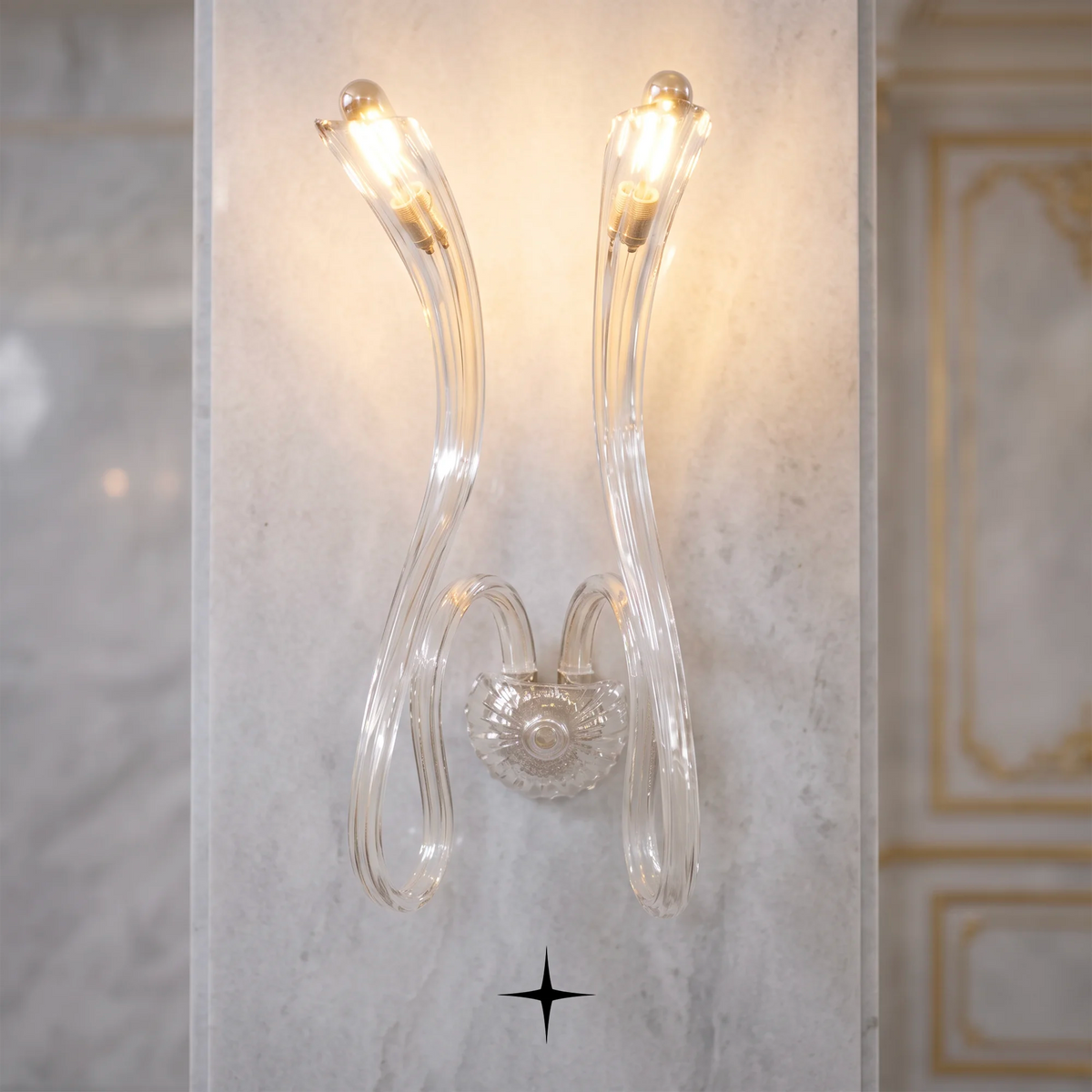 Amara wall light fixture featuring chic elongated crystal arms and modern luxury design.