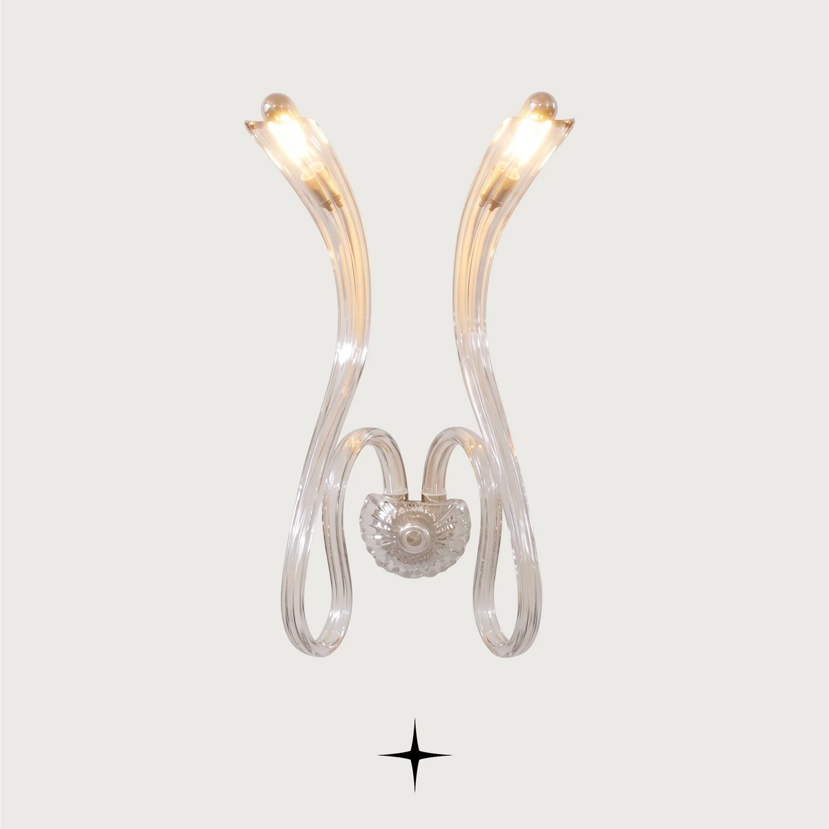 Amara wall light fixture featuring chic elongated crystal arms and modern luxury design.