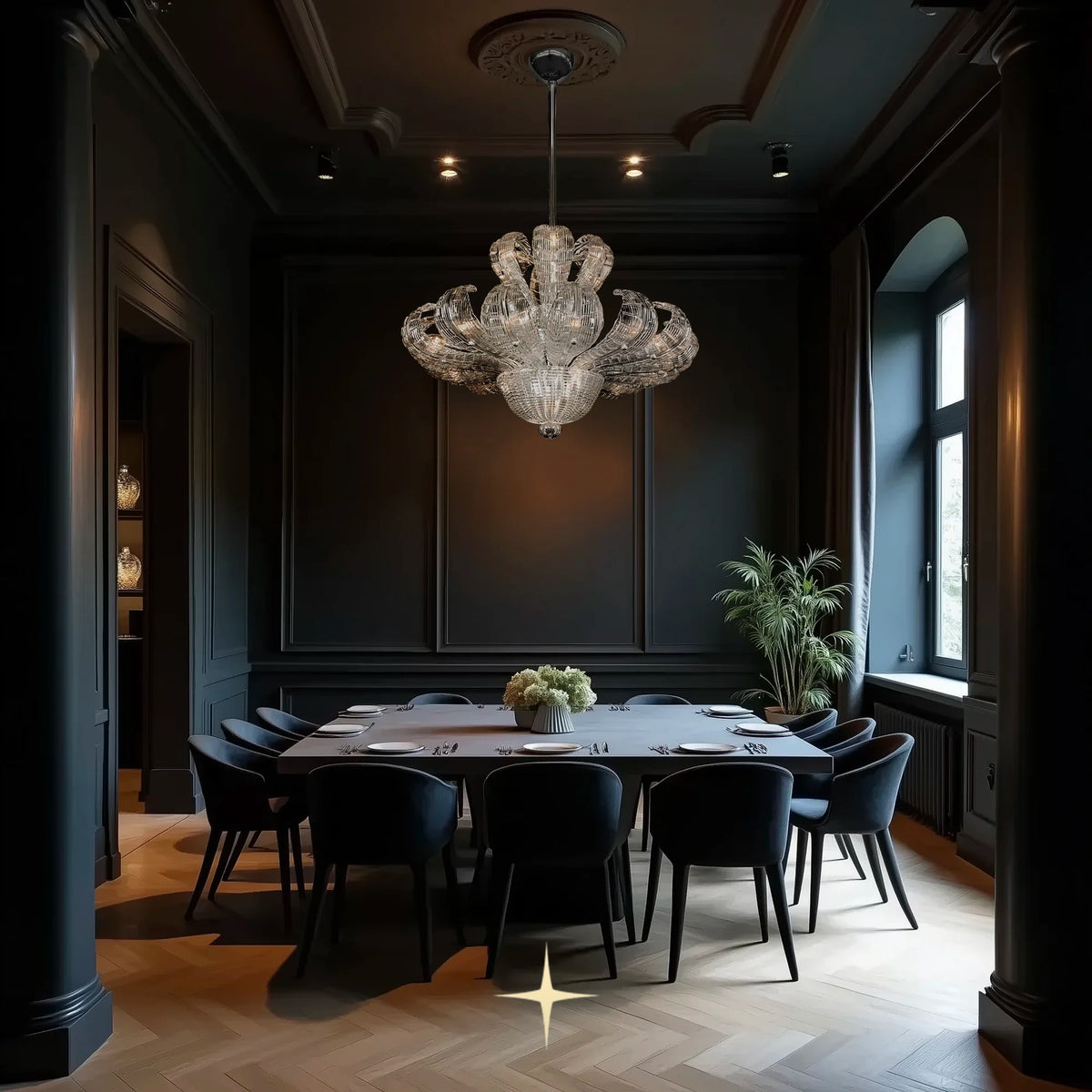 Angelica crystal chandelier installed above a dining table in a luxury dark-toned interior