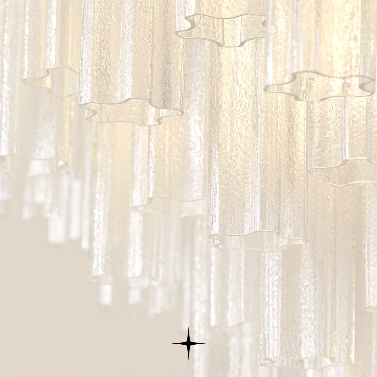 Close-up detail of illuminated ribbed glass cylinders on Astra chandelier frame