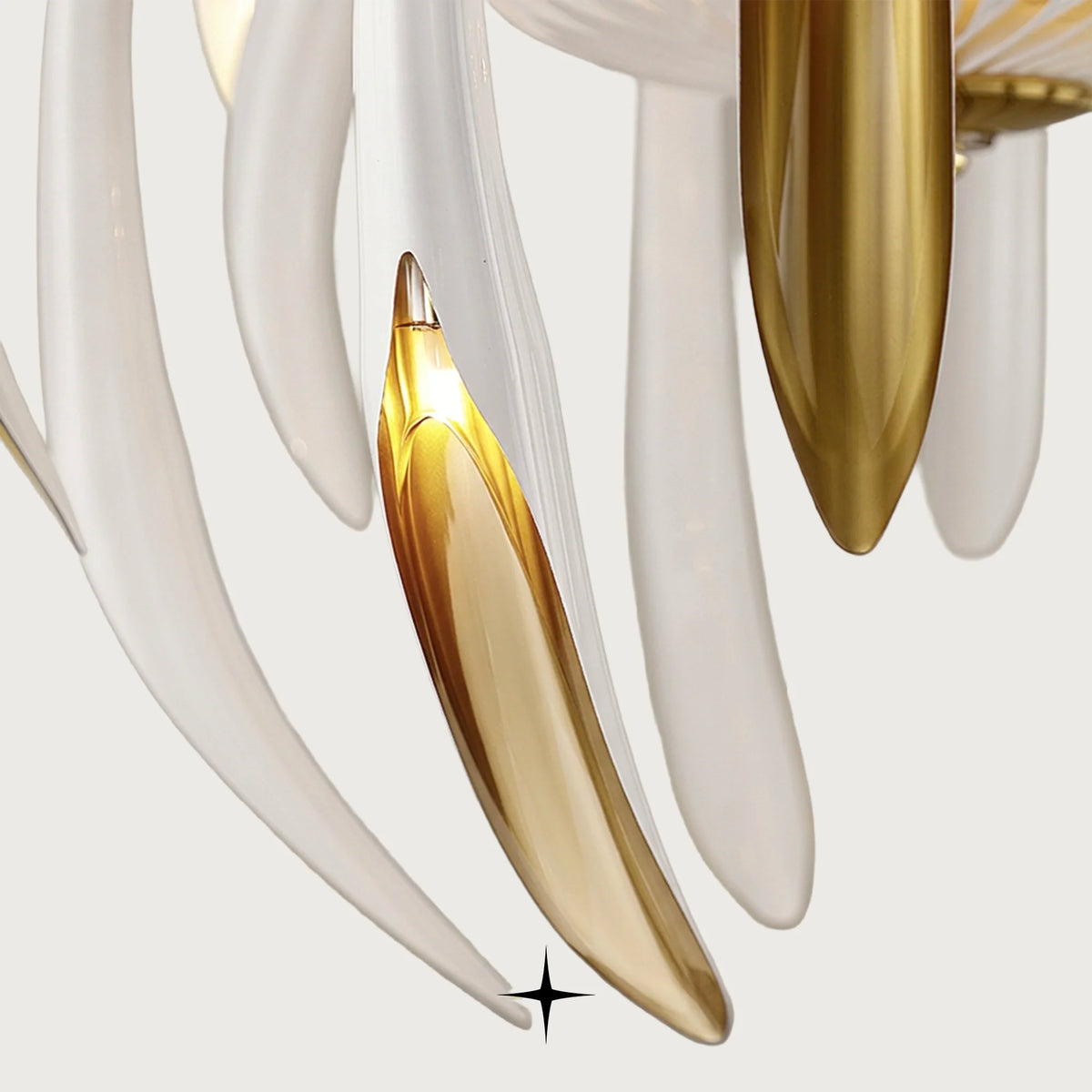 Close-up detail of golden inner accents and cascading white glass petals on Bellarian fixture