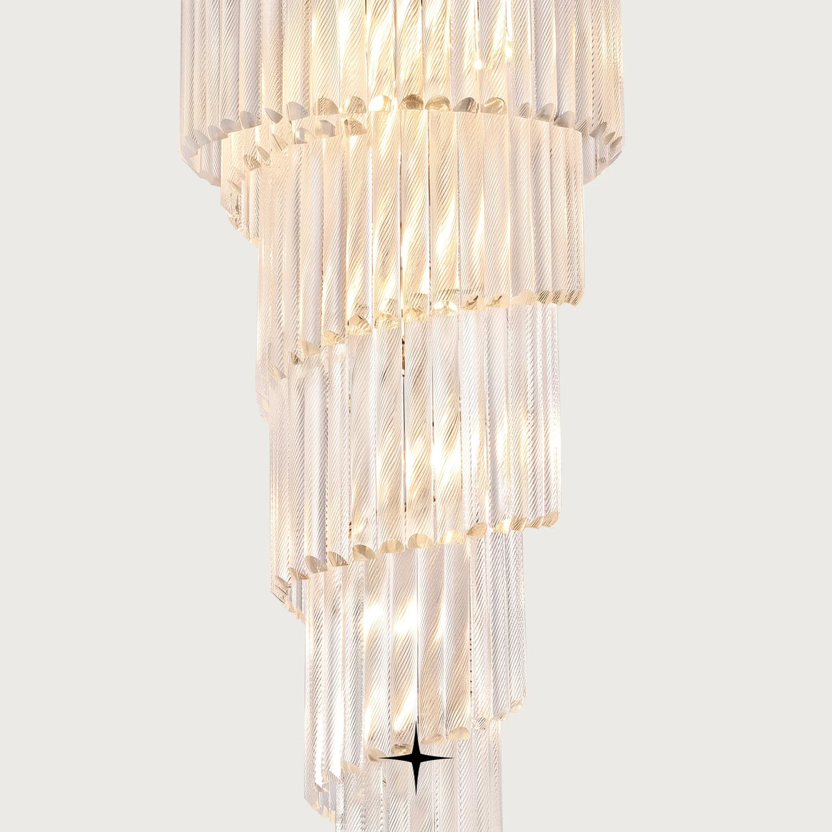 Angled shot of cascading clear glass tiers on the Bride spiral chandelier