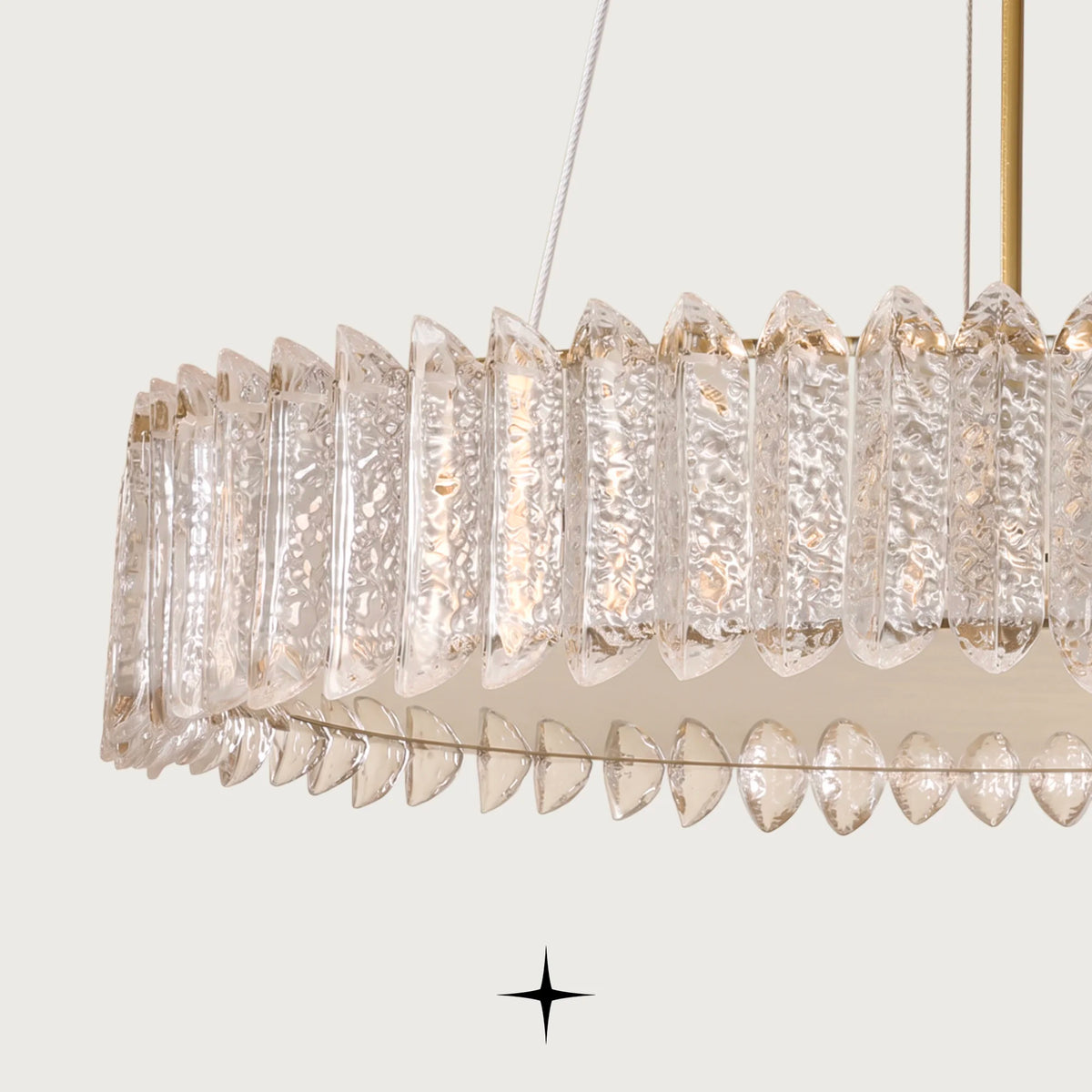 Close up detail of layered textured Murano glass pieces and warm gold frame on Calgary chandelier