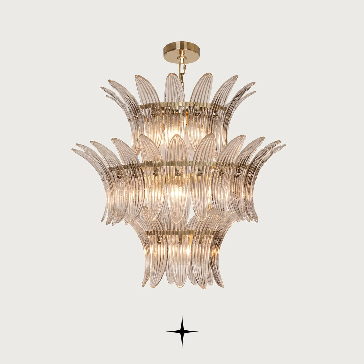 Crown Chandelier featuring tiered layers of Murano-style leaf-shaped glass and a radiant golden frame