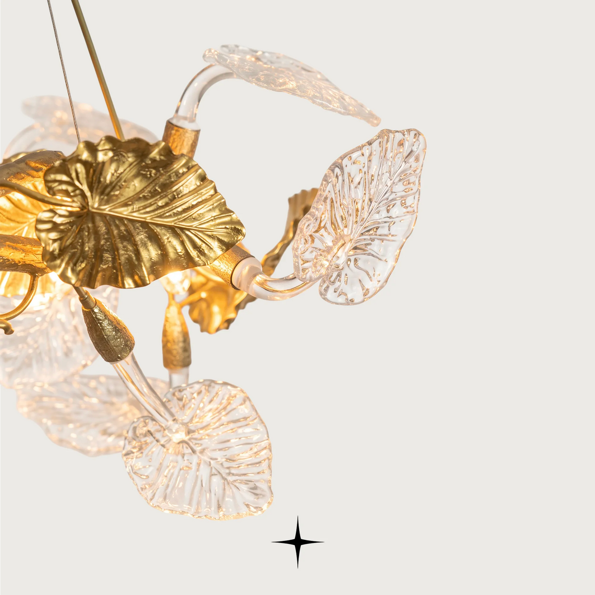 Detailed close-up of golden branches and handcrafted clear crystal leaves on Eldorado fixture