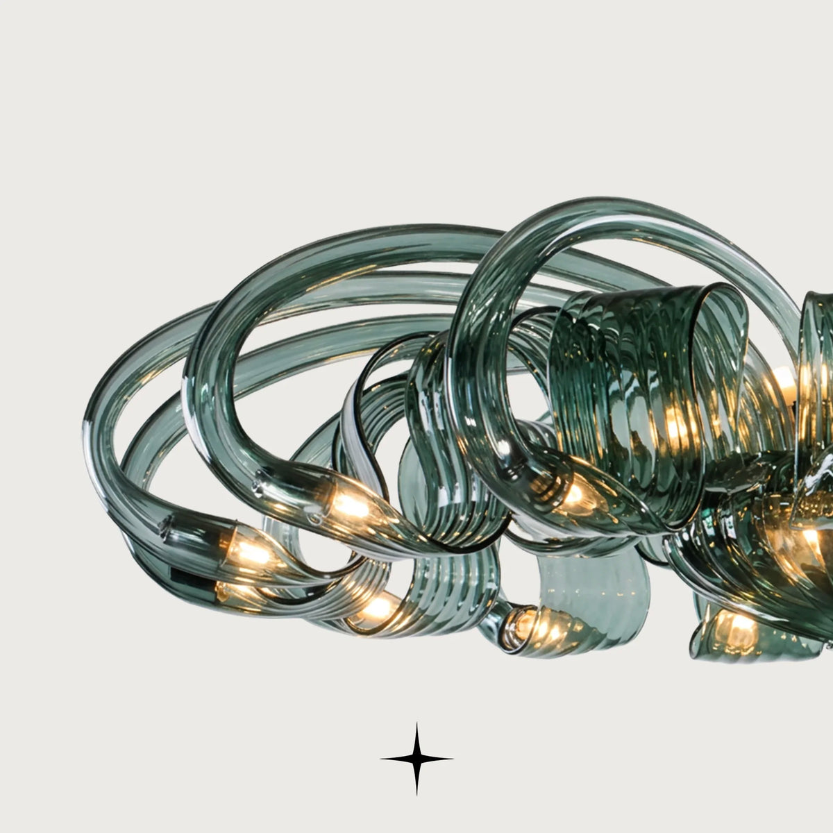 Eleanor Chandelier featuring intricate sapphire-green crystal arms in a luxurious modern design