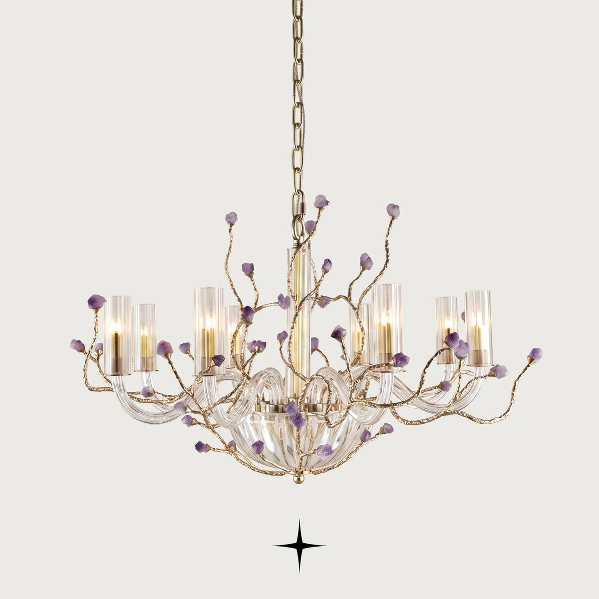 Elegant Madison Murano style glass chandelier with brass branches and natural purple rocks on a light grey background