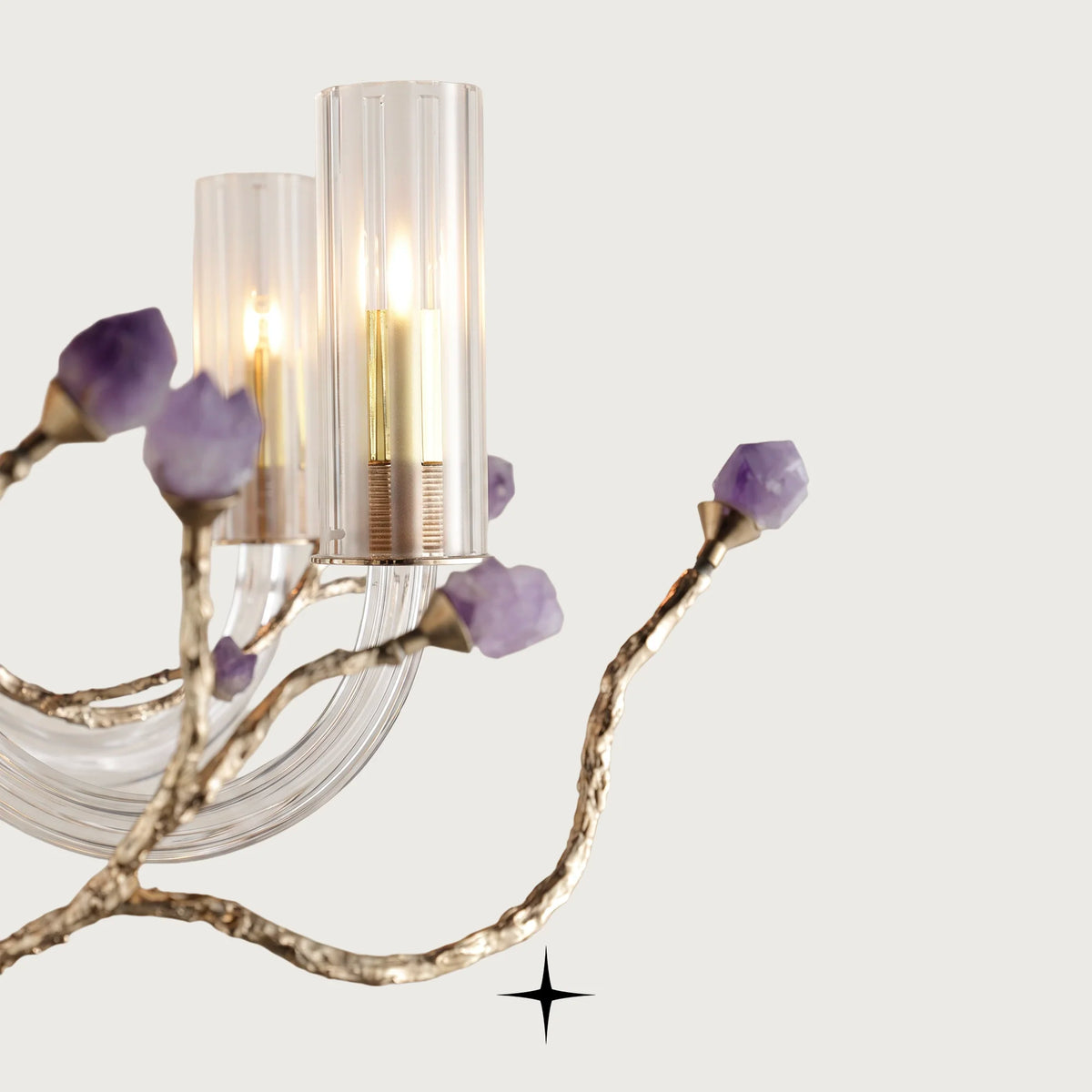 Close-up detail of natural purple rock accents on lustrous brass branches of Elegant Madison fixture