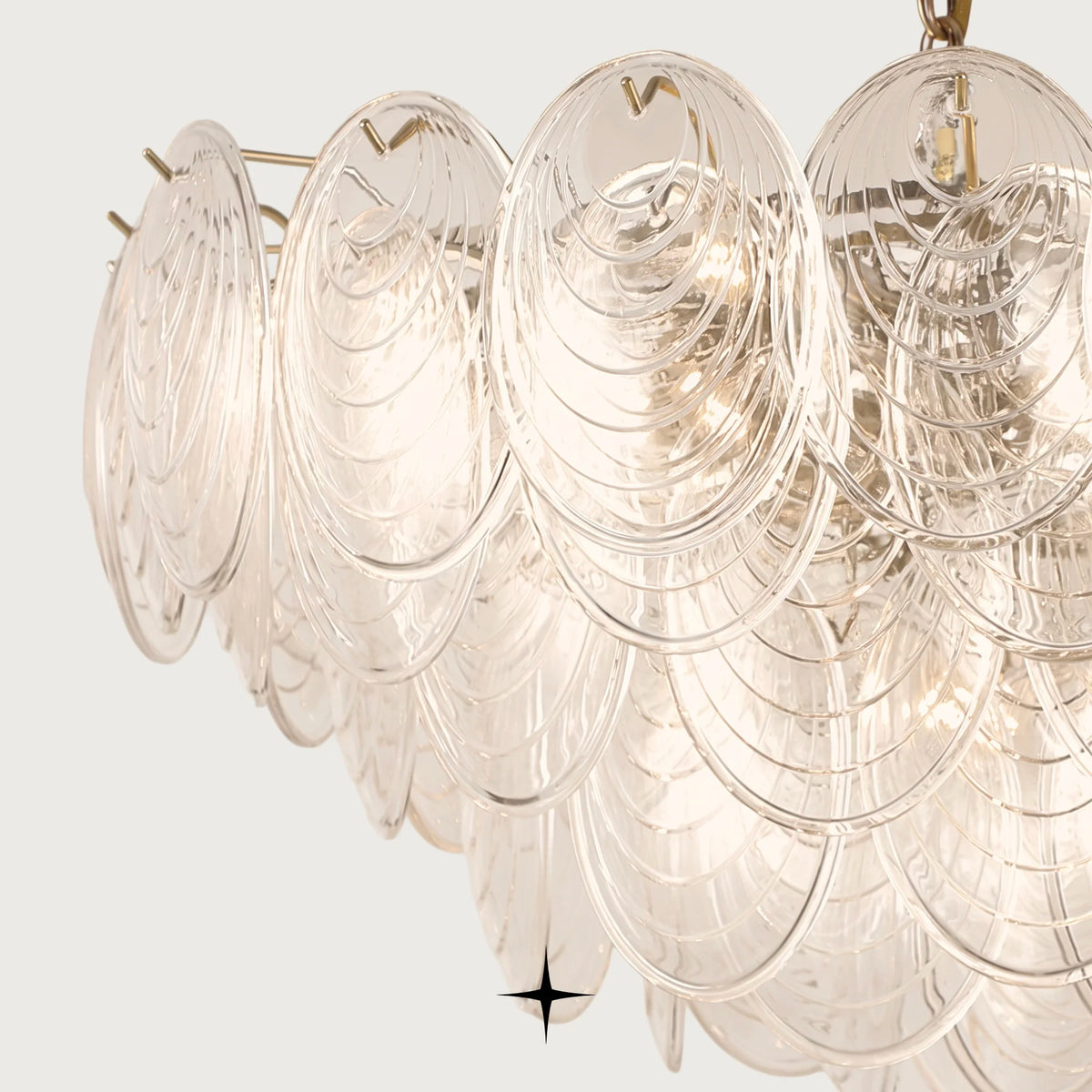 Elegant Moxie oval glass chandelier with golden nickel chain on clean background