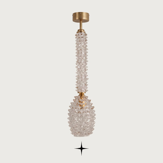 Front view of Elegant Sahara gold and clear glass column chandelier on light grey backdrop