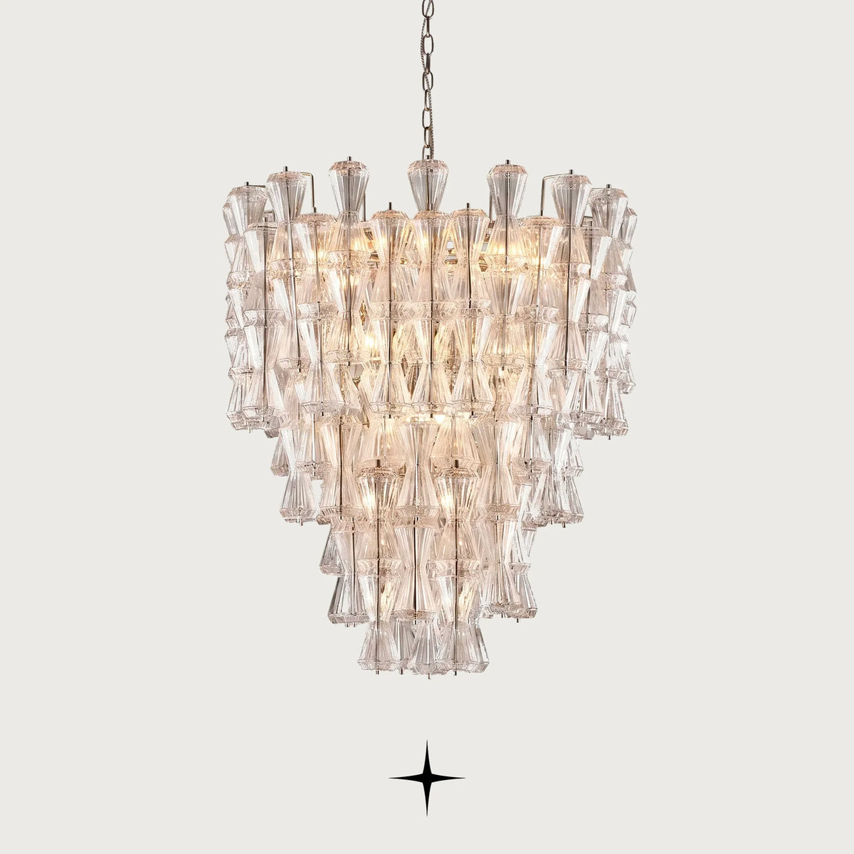 Elegant Seattle multi-tiered Rigadin glass hourglass chandelier illuminated on light grey background