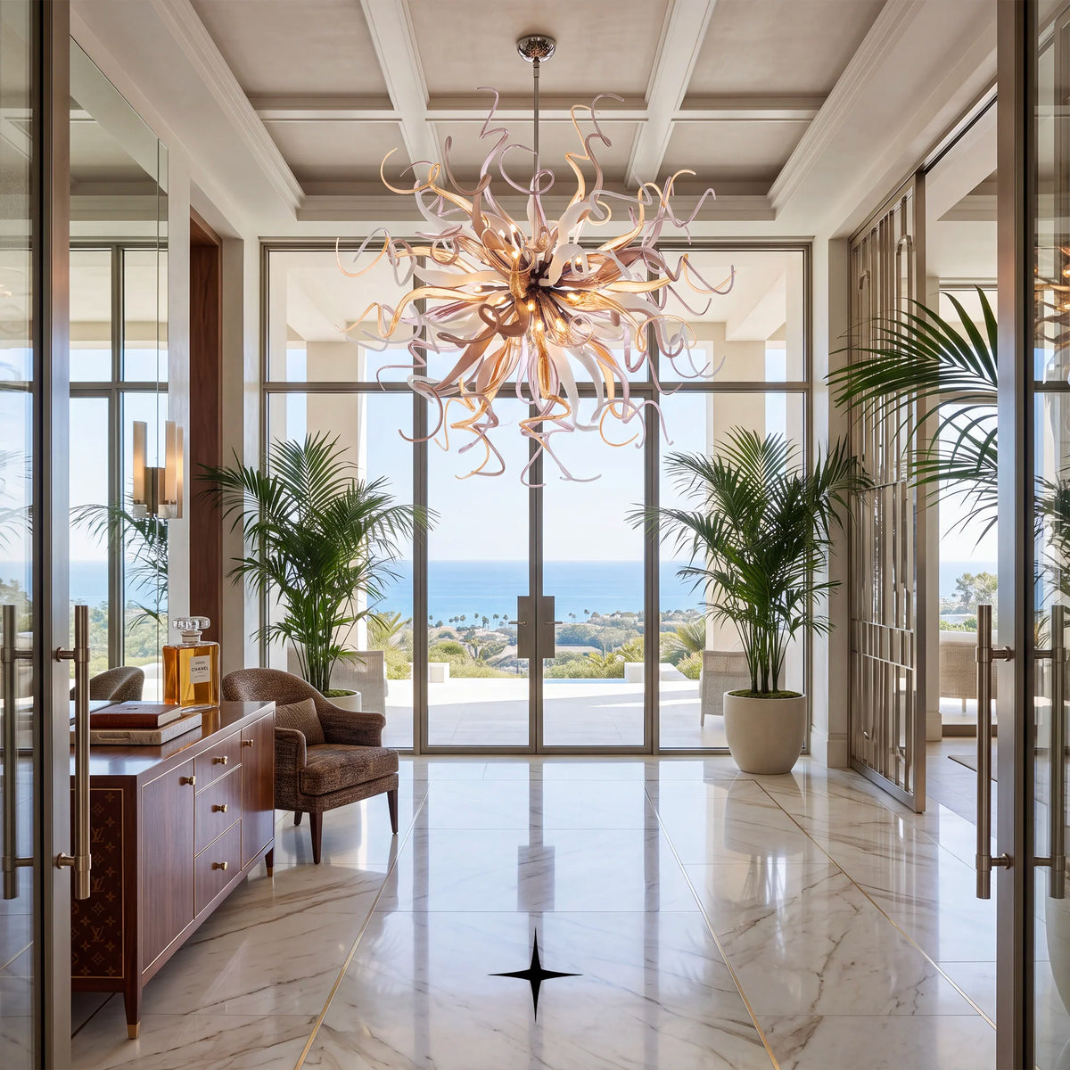 Freesia Chandelier featuring vibrant curved crystal glass tendrils forming a spherical burst with 44 G9 lights