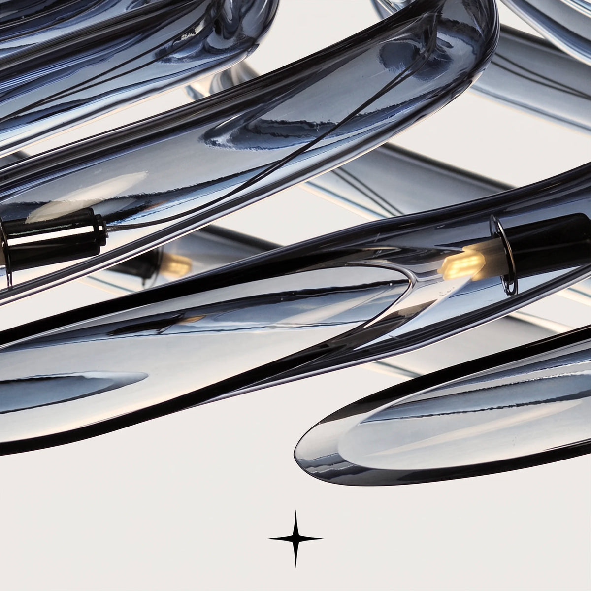 Gala Chandelier featuring cascading curved clear smoke blue crystal glass arms resembling a blooming flower