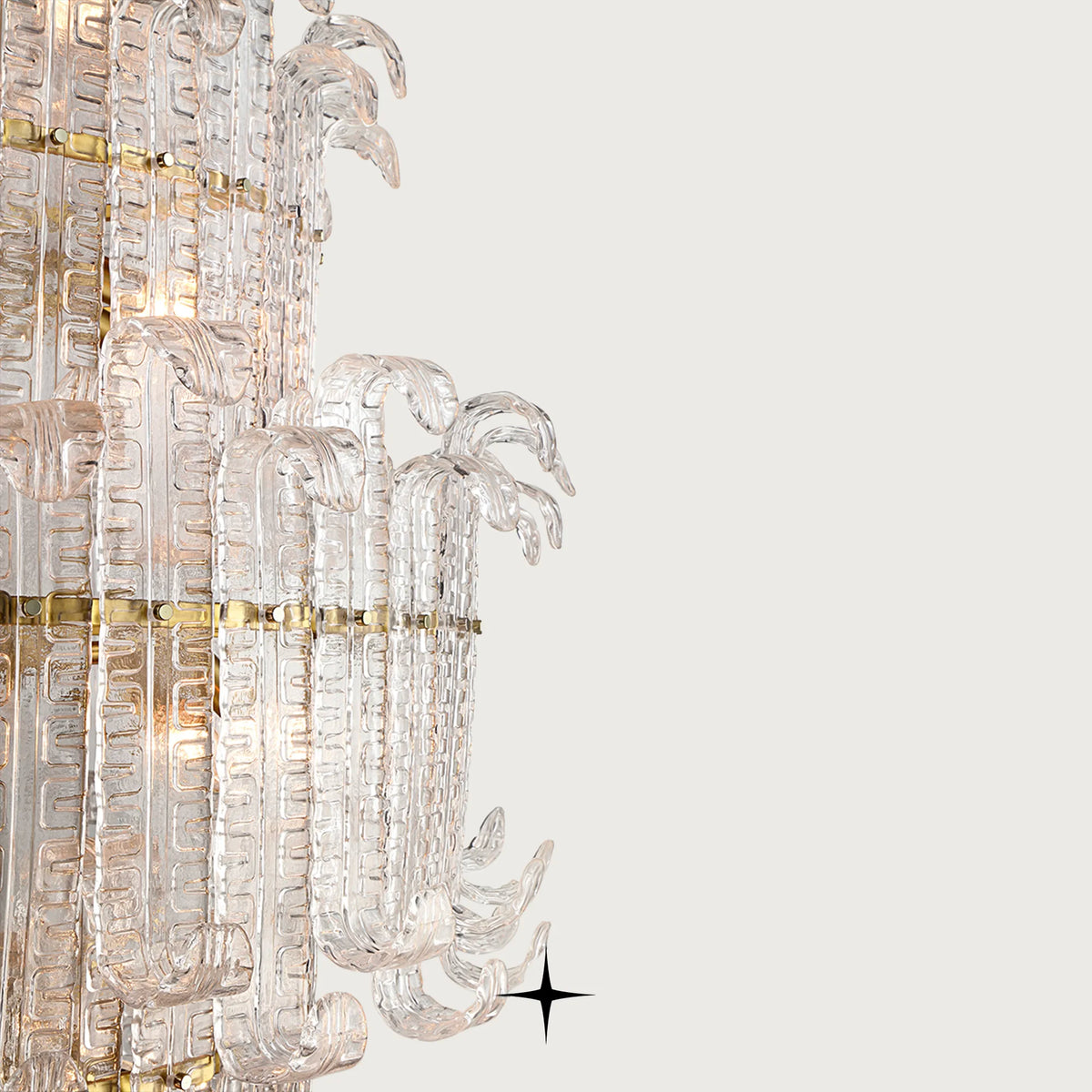 Close-up detail of handcrafted Murano style glass leaves and golden structure on Grand Montreal fixture