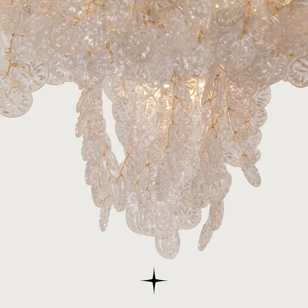 Close-up of layered clear glass teardrop elements on Grand Oslo light fixture