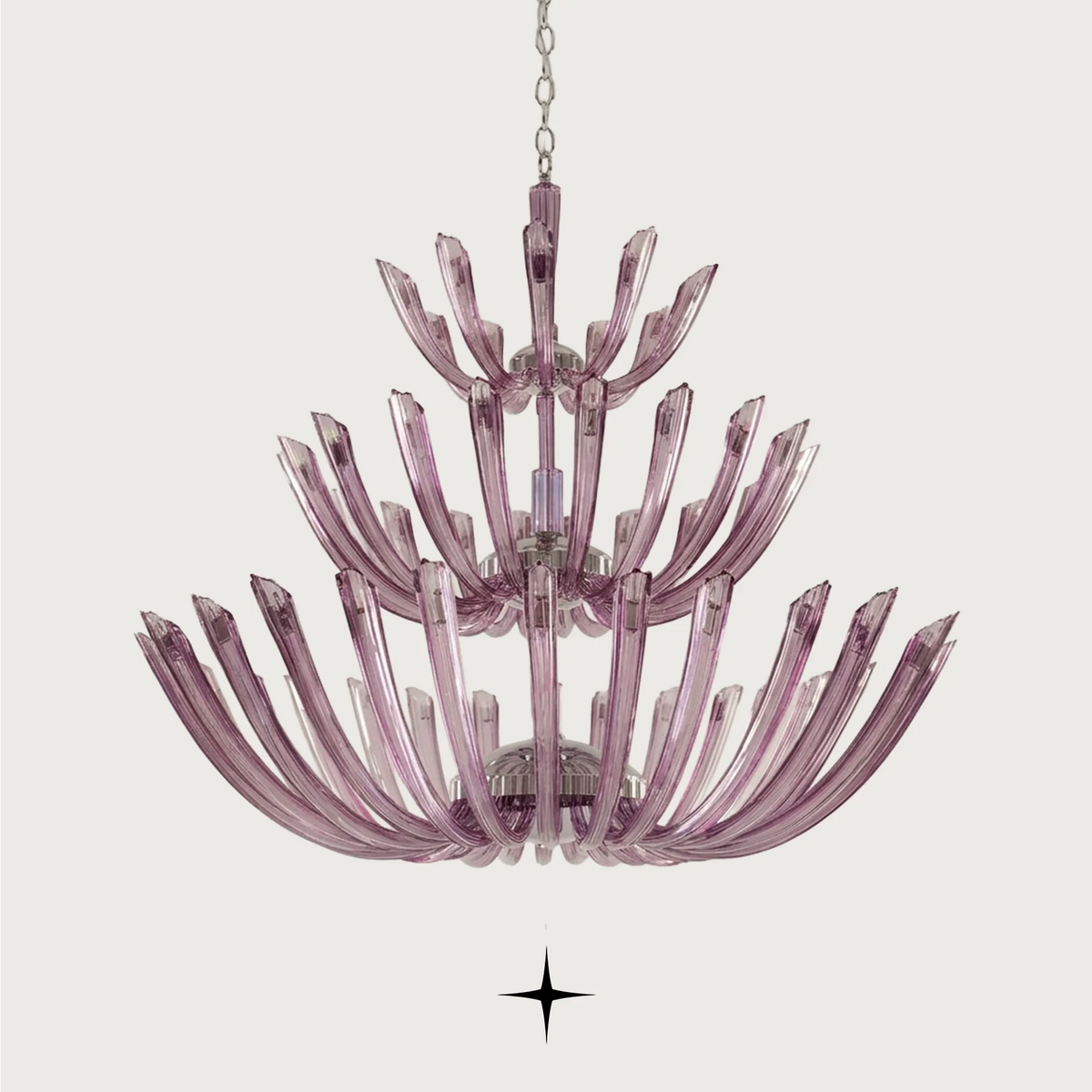 Grand Sienna Chandelier featuring chic elongated crystal arms available in five chandelier sizes and a wall lamp.