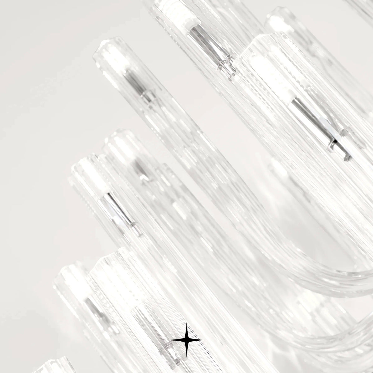 Close-up detail of curved fluid glass tubes on Grand Solara chandelier