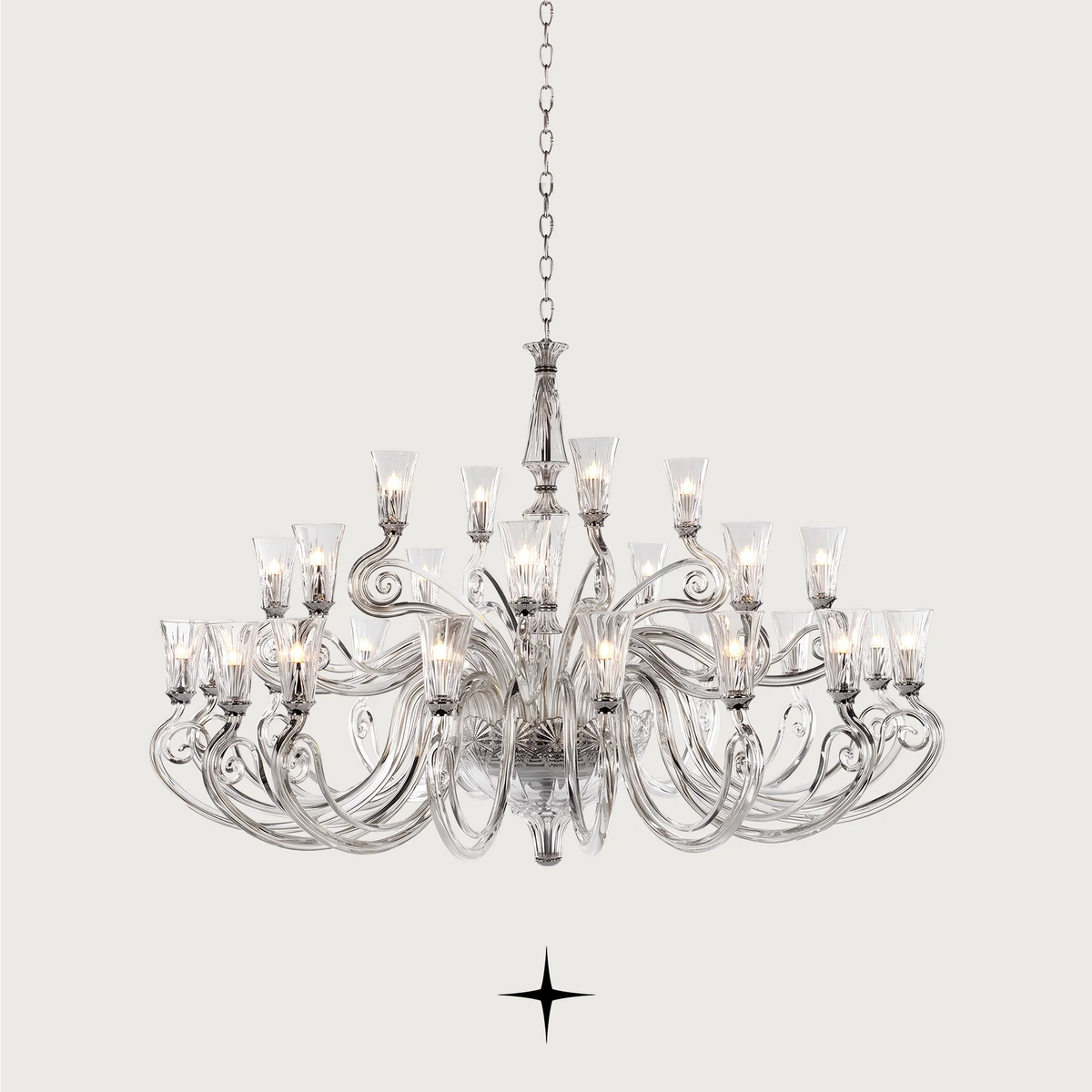 Grand Sophia Chandelier featuring chic elongated crystal arms available in five chandelier sizes and a wall fixture.