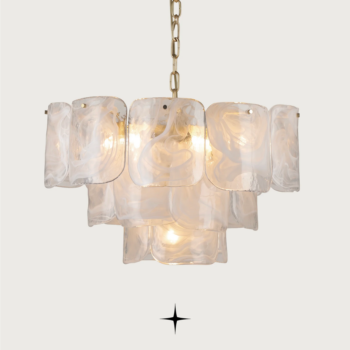 Imara luxury chandelier featuring layered milky crystal glass petals with gold hardware