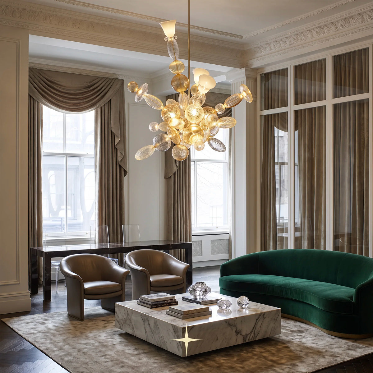 Lambada chandelier hanging over a long dark dining table in a contemporary space
