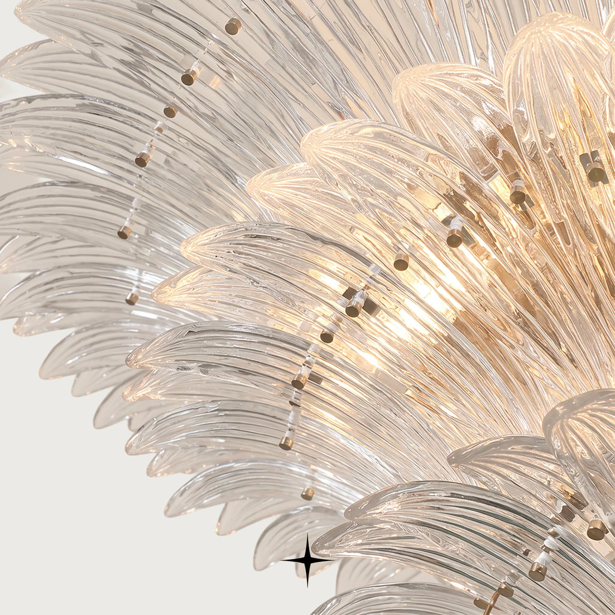 Side view of Lavish Crown crystal chandelier showing tiered glass leaves and golden frame