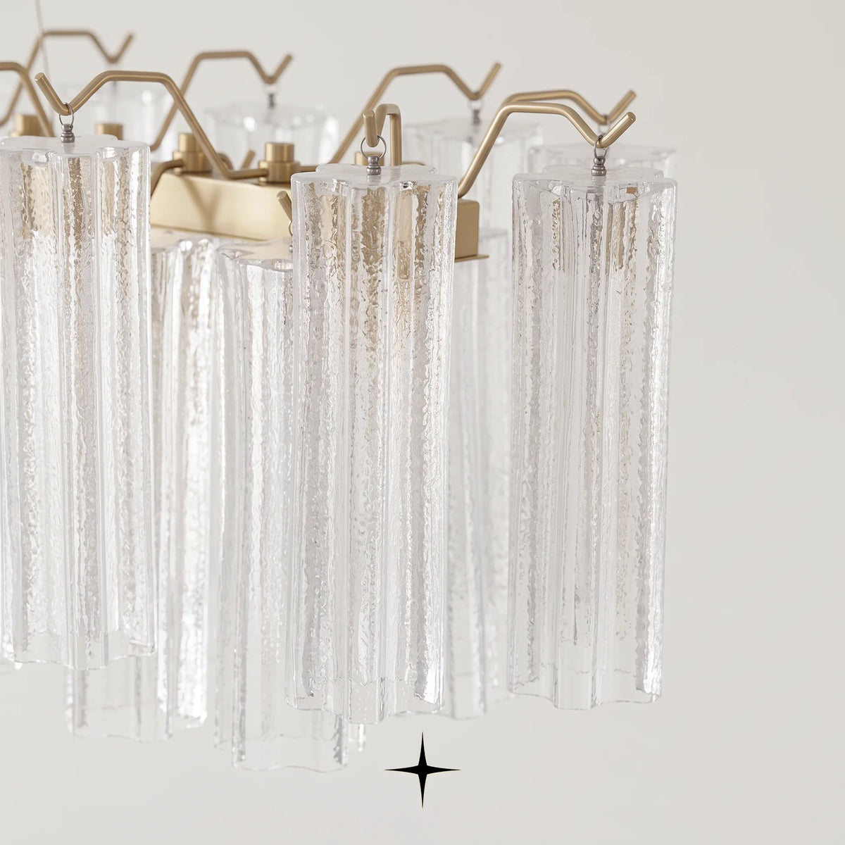Front view of Linear Astra modern glass column island light fixture on light grey backdrop