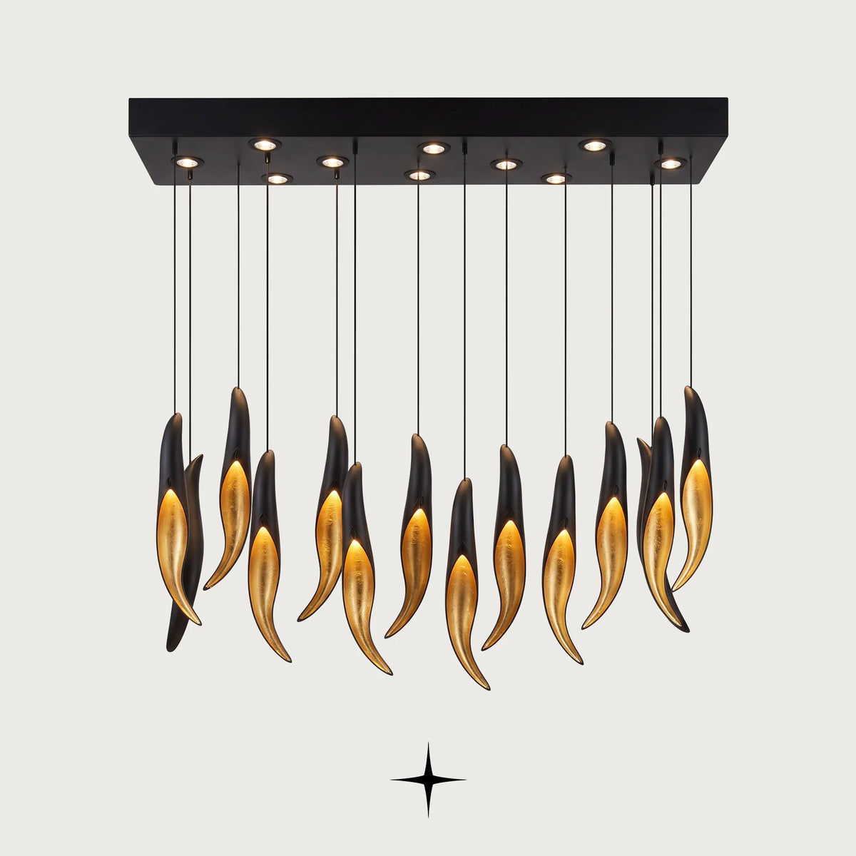 Linear Darken chandelier featuring a matte black layer over golden crystals and striking contrast