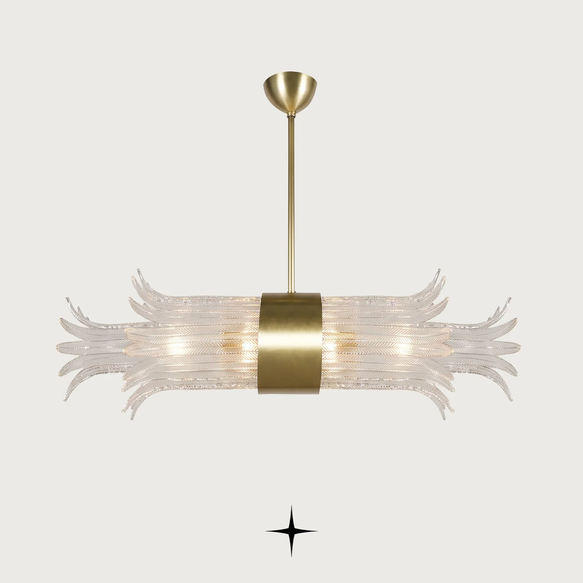 A modern horizontal chandelier with a brushed gold metal frame and a clear glass tube diffuser that spreads outward in a leaf-like pattern, suspended against a light gray background.