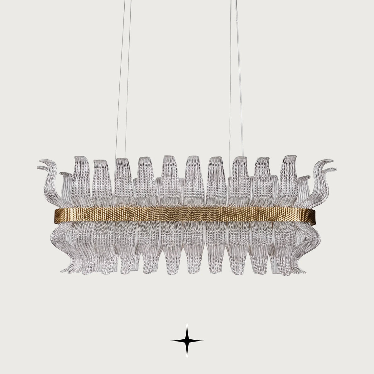 Linear Helena chandelier featuring handcrafted Murano glass leaves and gold frame on black background
