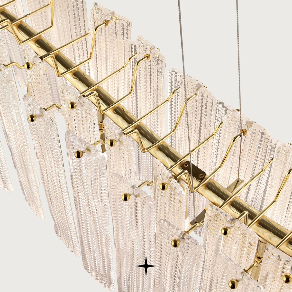 Side perspective of Linear Isabella chandelier showing cascading textured glass details