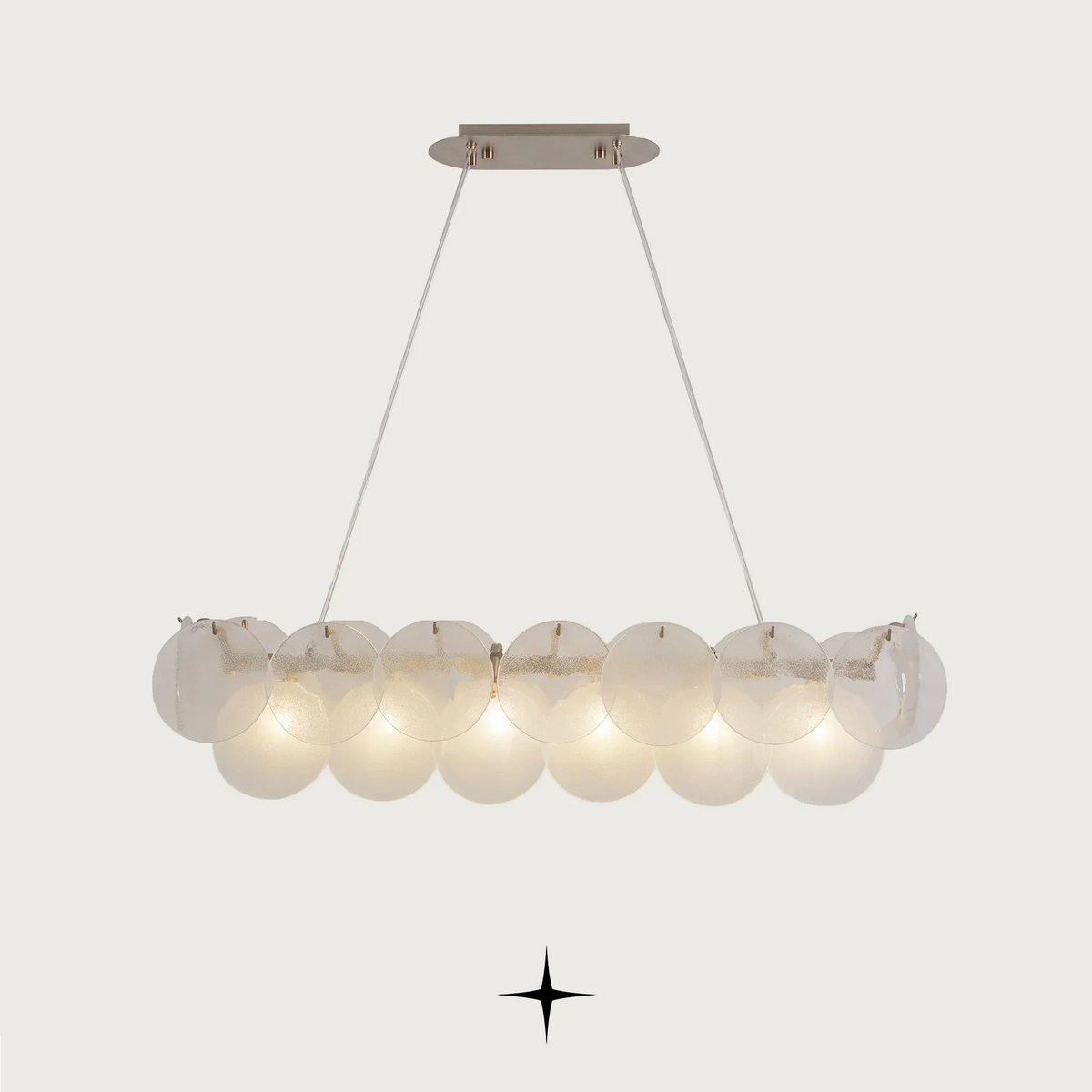 Linear Lunaria Chandelier featuring frosted glass discs resembling Lunaria seedpods and subtle brass accents.
