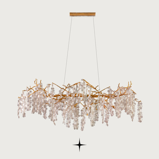 Front view of Linear Shiraz brass vine island lighting fixture on light grey backdrop