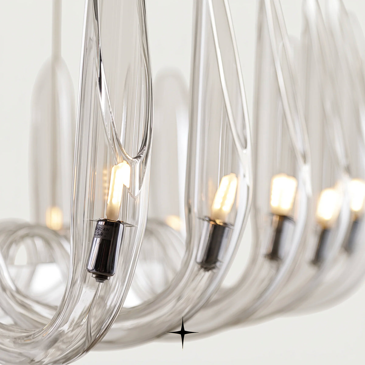 Linear Whistler chandelier featuring handmade smoke blue crystal bubbles and upward-facing wings