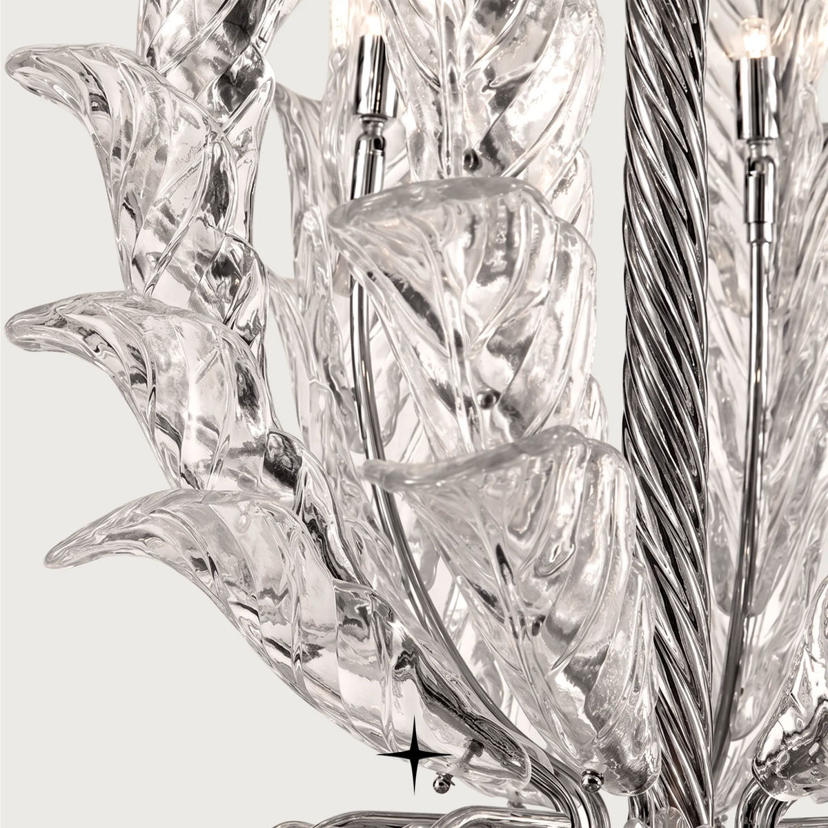 Top-angle view of delicate clear crystal leaf panels on the Madam chandelier