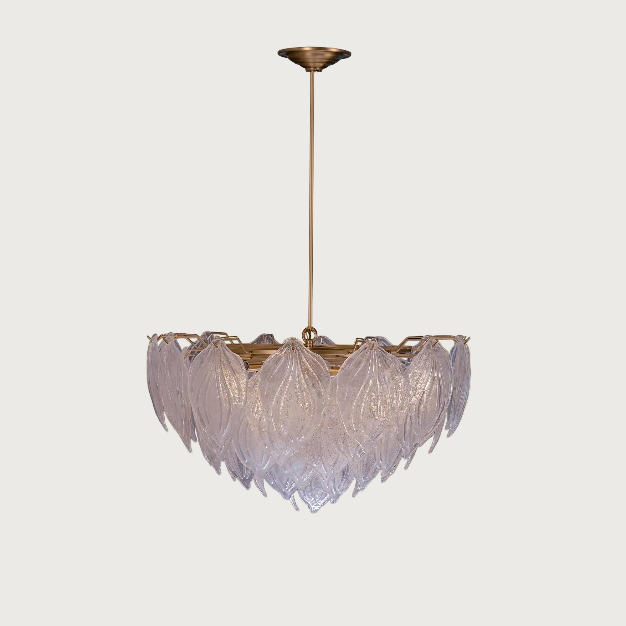 Mellow layered textured glass leaf chandelier with brass stem on light grey background