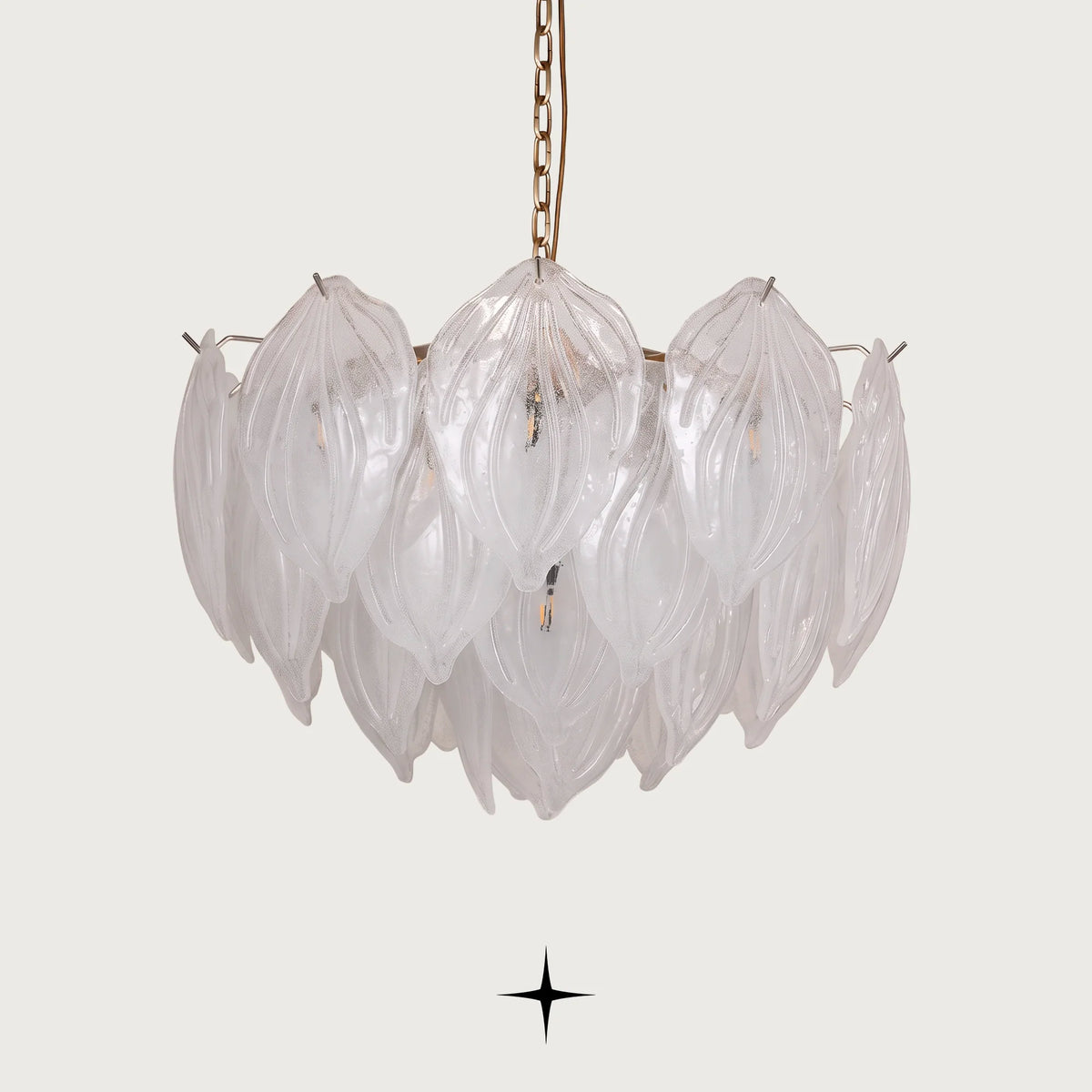 Mellow Murano style glass leaf chandelier with golden nickel structure on dark background