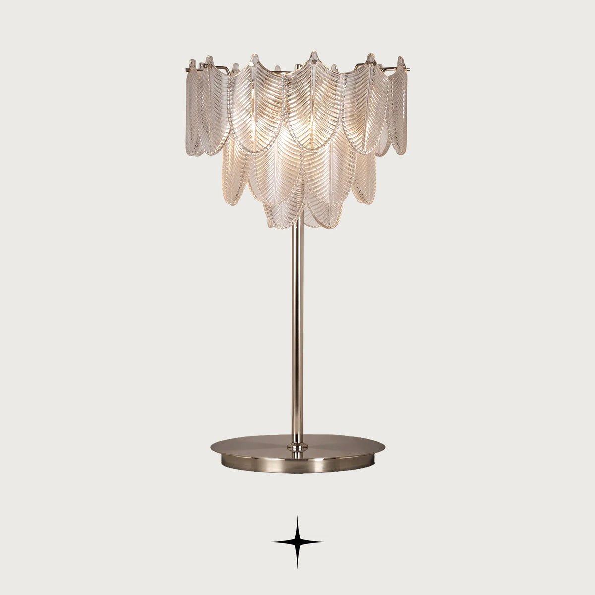 Nola Murano style glass leaf table lamp with golden nickel base on a light grey background