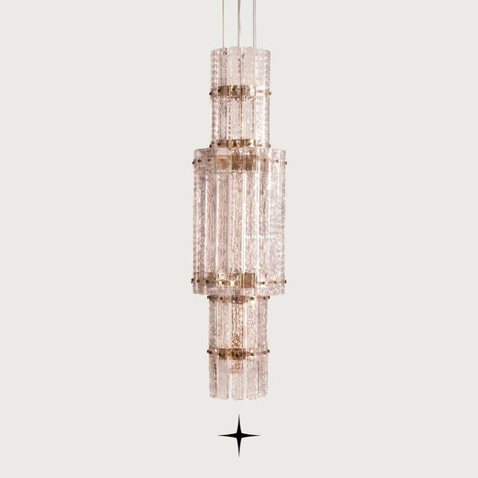 Front view of One Level Chime tall glass LED pendant fixture on light grey backdrop