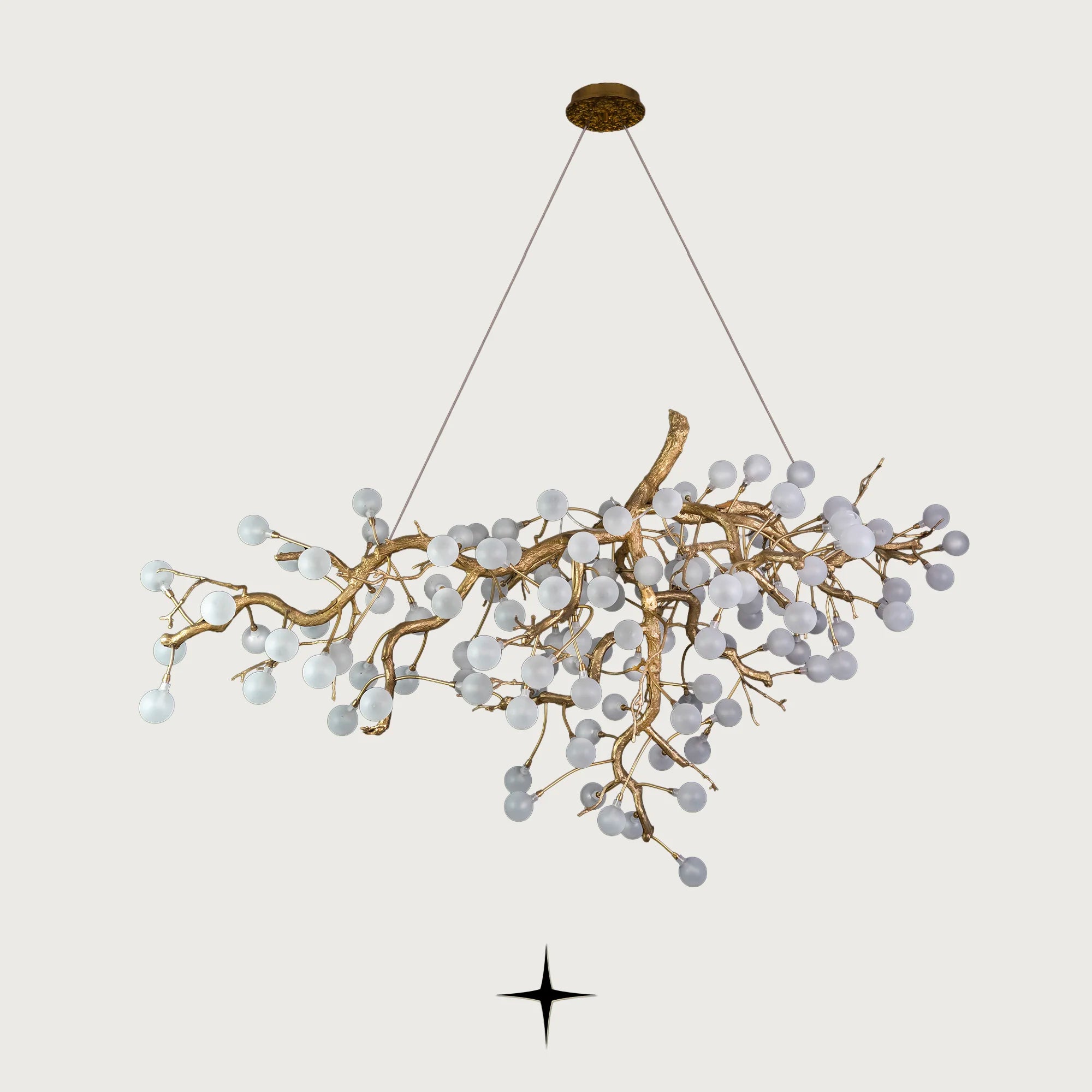 Romantica brass tree branch chandelier with crystal blossom bulbs on light grey background