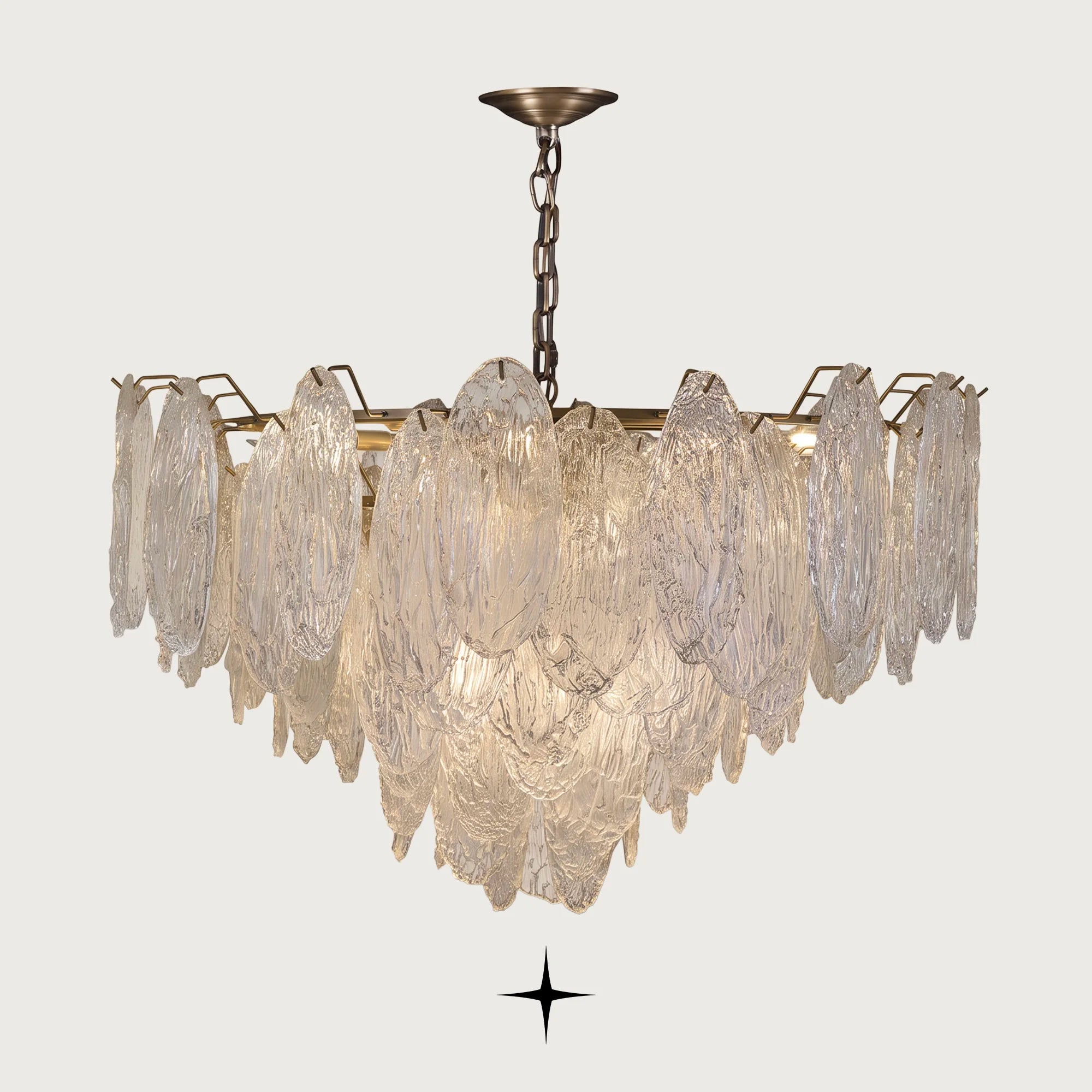 Saliva cascading textured glass leaf chandelier with brass frame on light grey background
