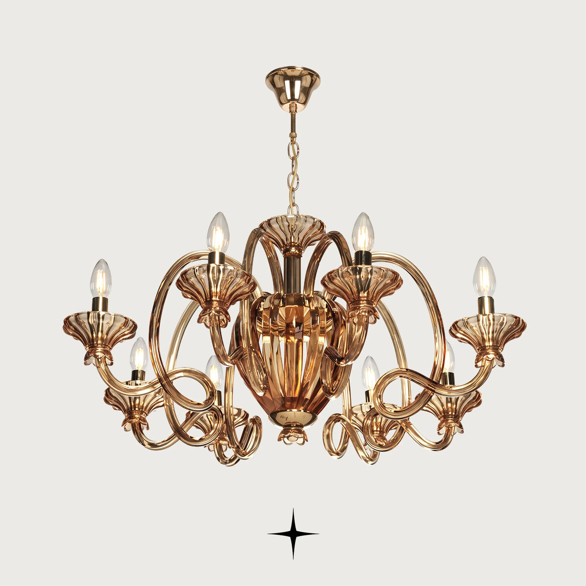 Theodora Chandelier featuring chic elongated crystal arms in warm amber across two size options