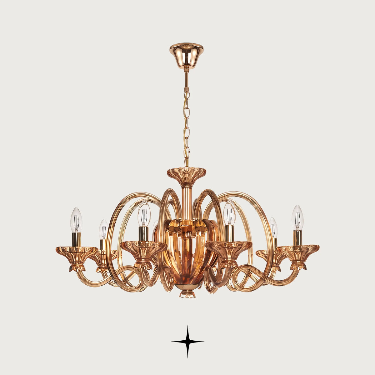 Theodora Chandelier featuring chic elongated crystal arms in warm amber across two size options