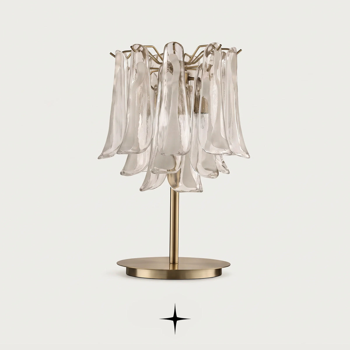 Tranquility handcrafted Murano glass tear table lamp with golden nickel base on a light grey background