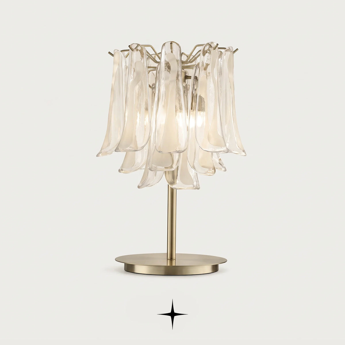 Tranquility handcrafted Murano glass tear table lamp with golden nickel base on a light grey background