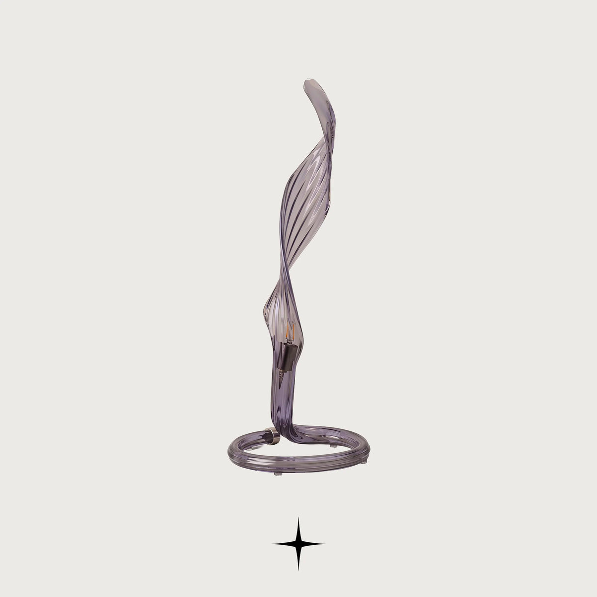 Uma modern sculptural table lamp with curved crystal arms on a light grey background
