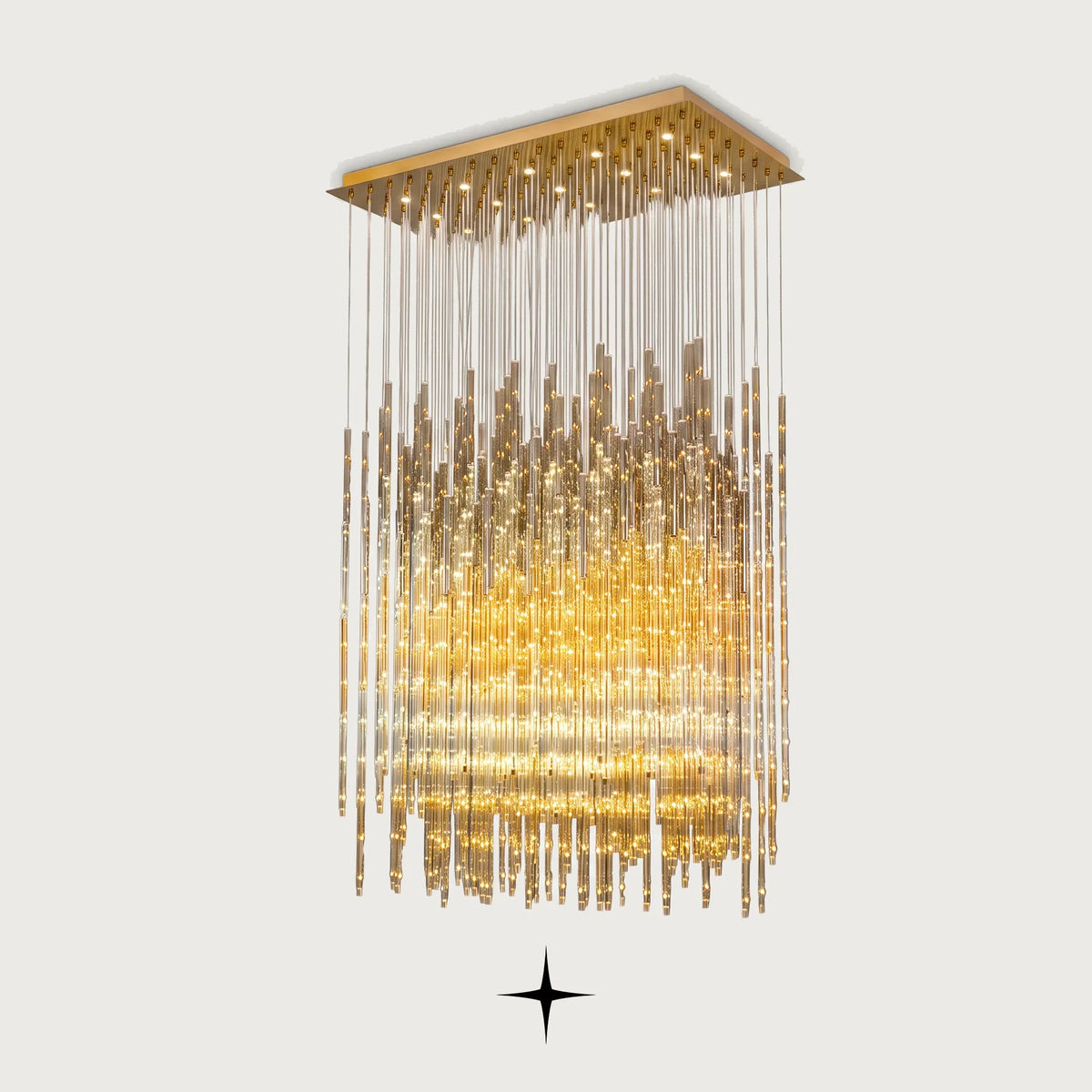 Echo cascading golden glass waterfall chandelier with brass frame on light grey background