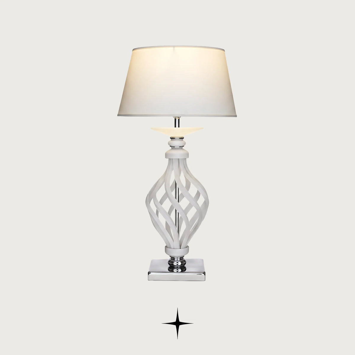 Xena traditional table lamp with woven lattice crystal stem and pleated white shade on a light grey background