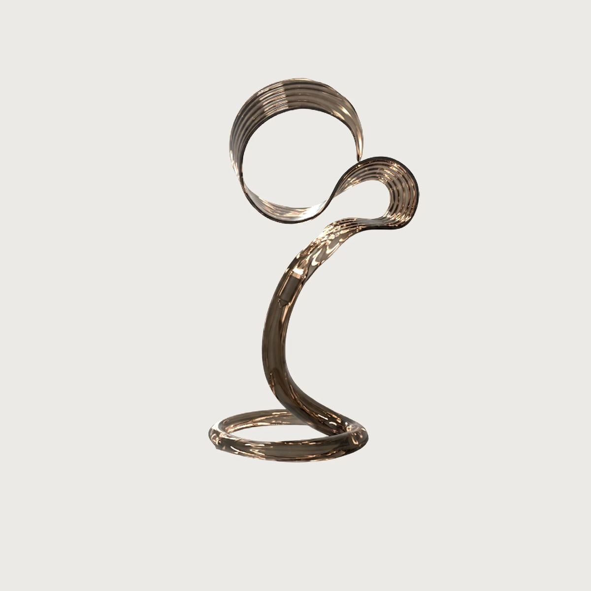 Yara modern sculptural swirl table lamp with metallic finish on a light grey background